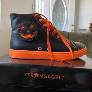 Strange cvlt black and orange jack Chelsea sneakers